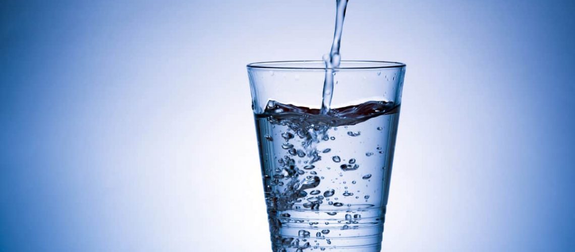 Pouring water into glass